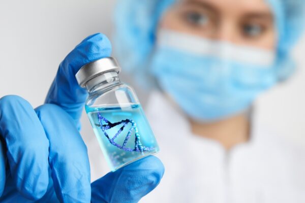 Scientist holding a vial with a DNA strand visual, used for a MiDOG blog about Streptococcus equi, metagenomic sequencing, and advanced microbial diagnostics in equine health.