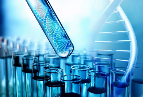 A laboratory image showing test tubes and a stylized DNA strand, representing molecular diagnostics and genomic testing used to detect infectious agents with greater specificity.